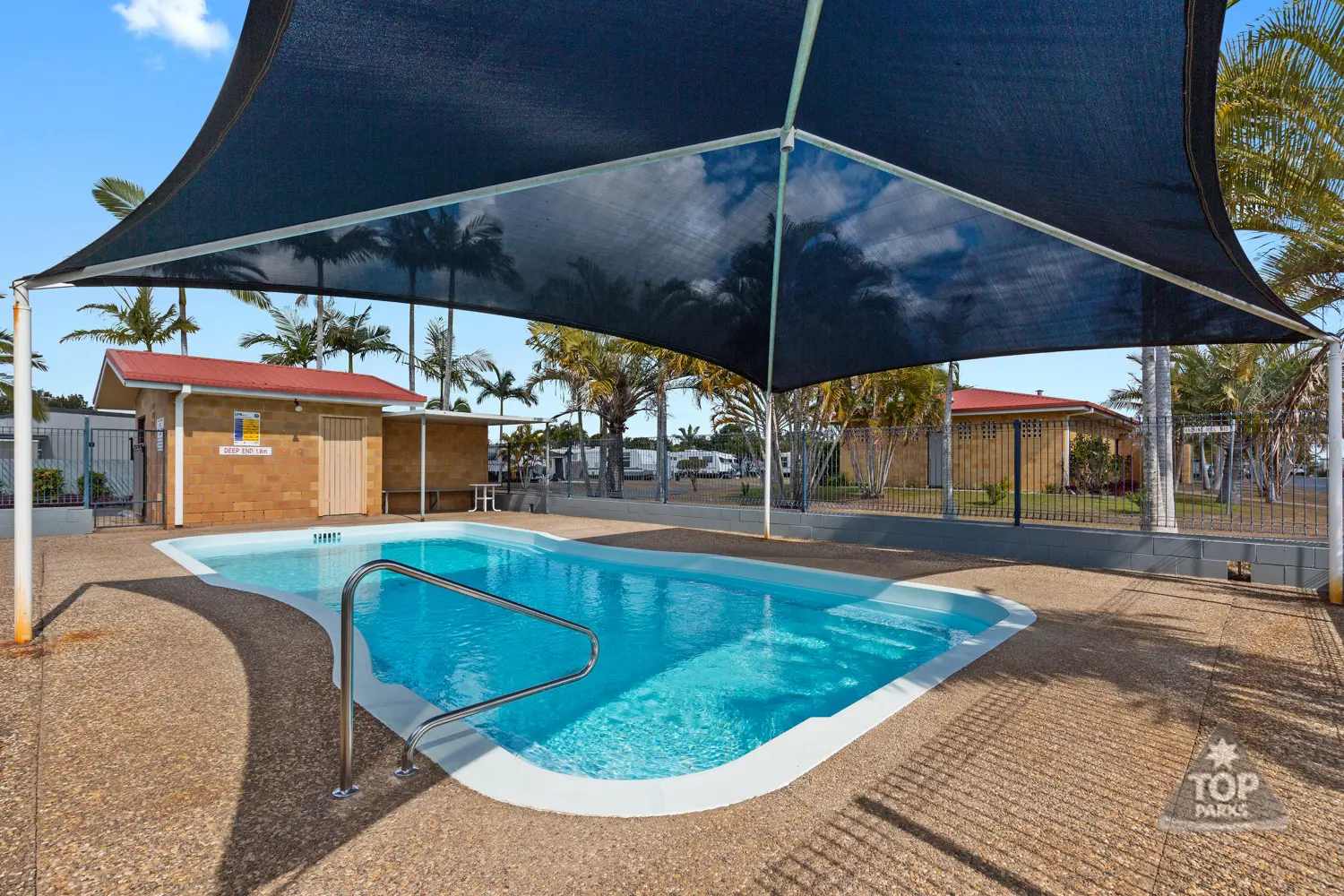 The shaded swimming pool at Glenlodge Caravan Village